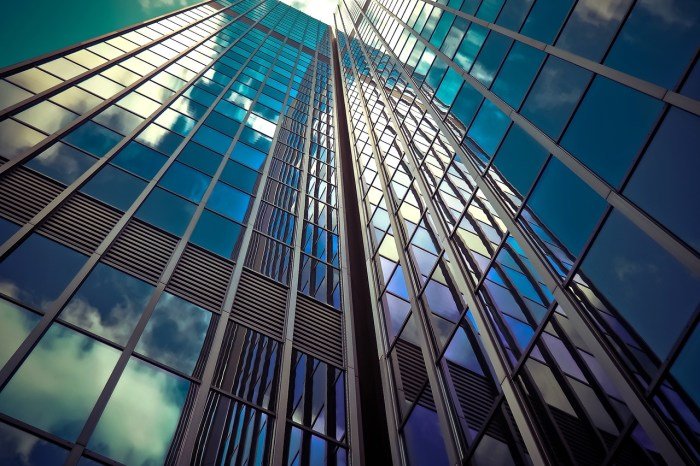 Sky blue background skyscraper building modern architecture jooinn stock